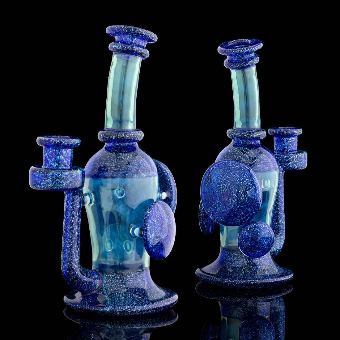 Accented Recycler — two deep blue galaxy recycler rigs side by side on black background
