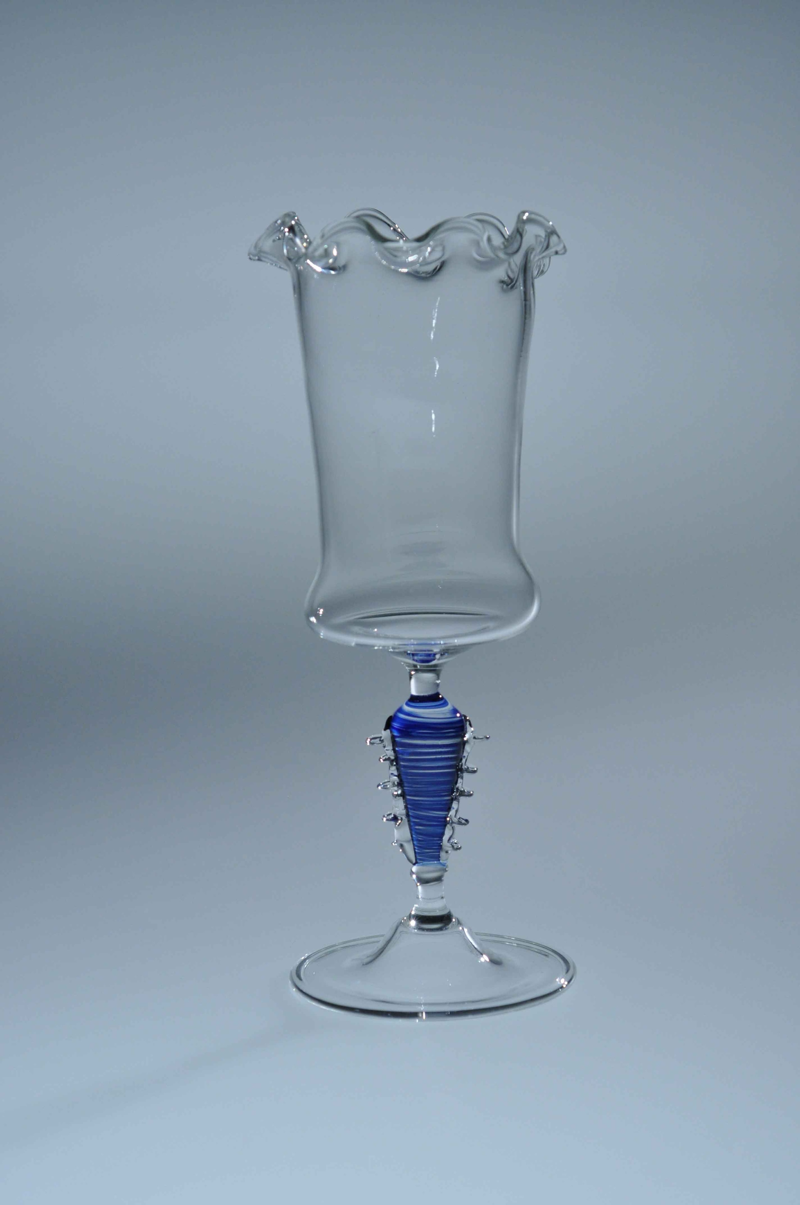 Goblet — clear glass with ornate blue wrapped stem and ruffled rim