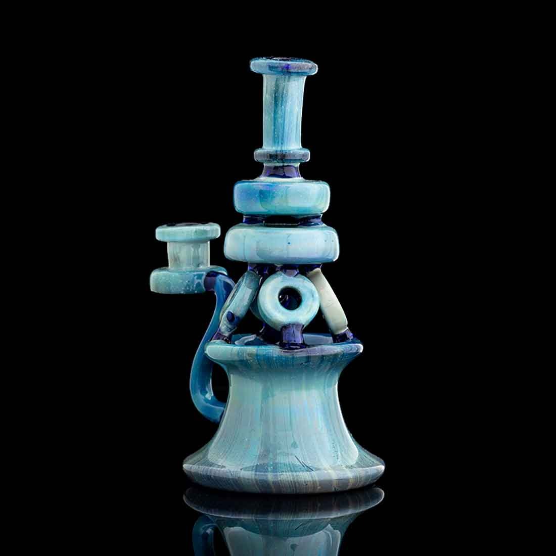 Silver fume — teal and blue recycler rig on black background