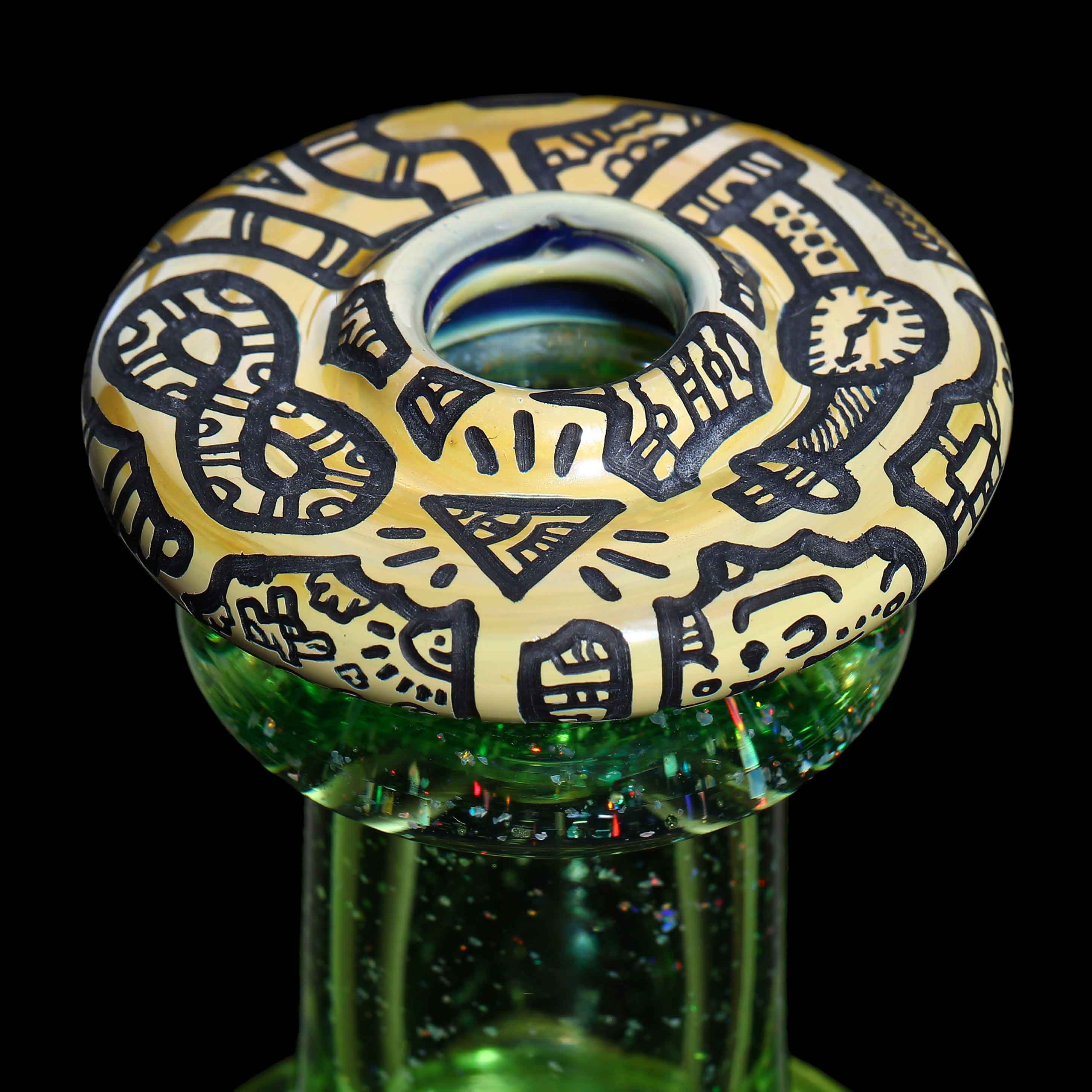 Focus Series — macro close-up of the illustrated mouthpiece disc with tribal pattern