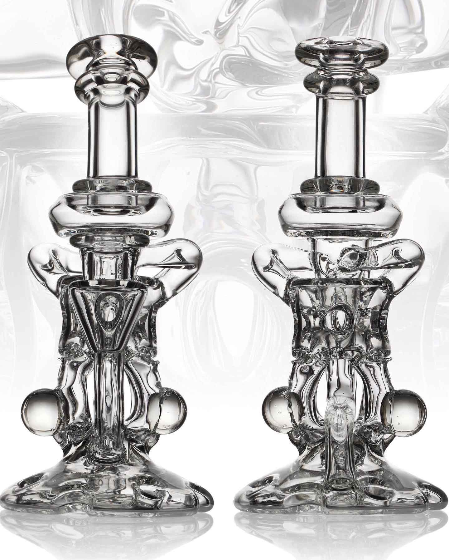 Clear borosilicate pair — two matching sculptural recycler rigs side by side