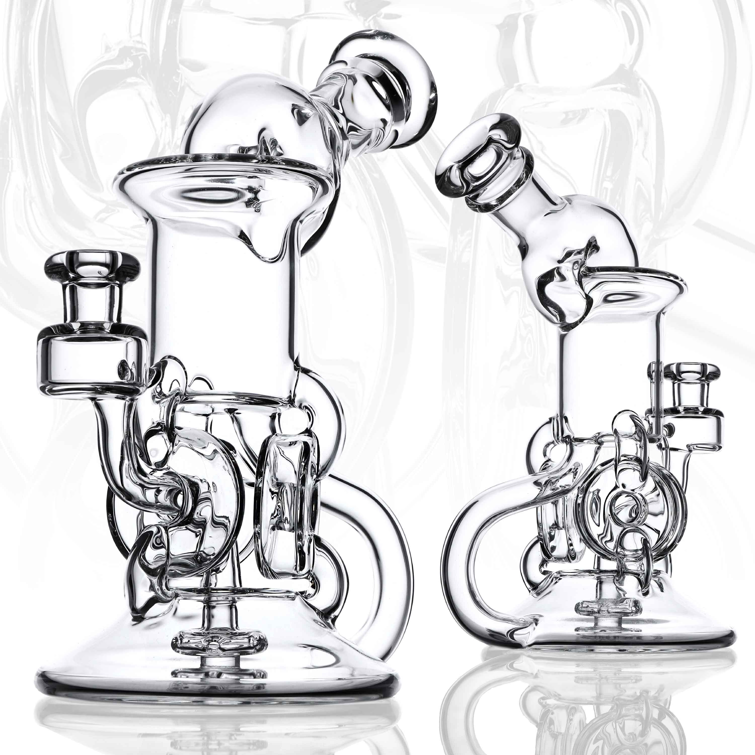 Ubik Series — two clear borosilicate recycler rigs side by side on white background
