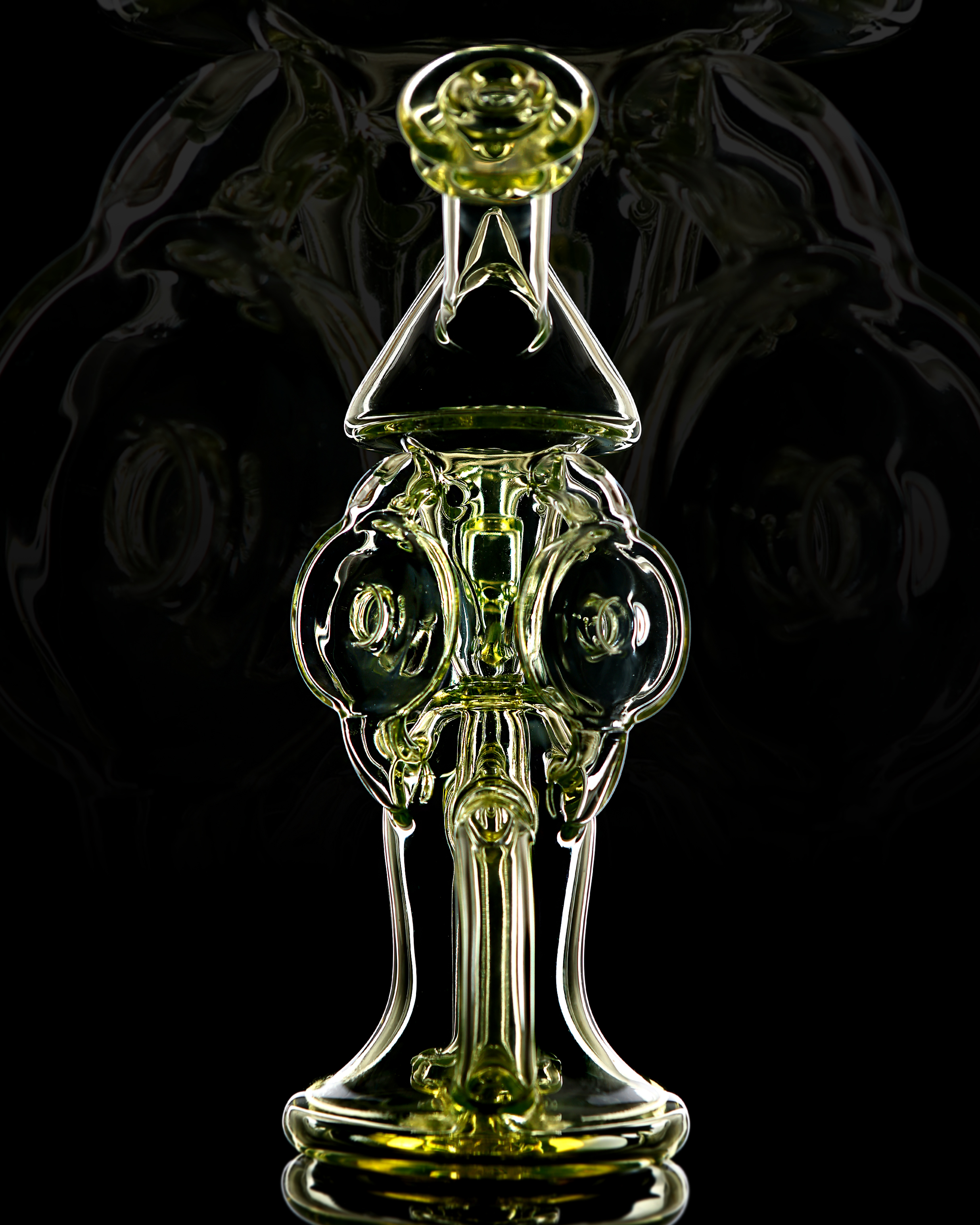 UV Series — yellow-green sculptural rig front view with dark reflective background
