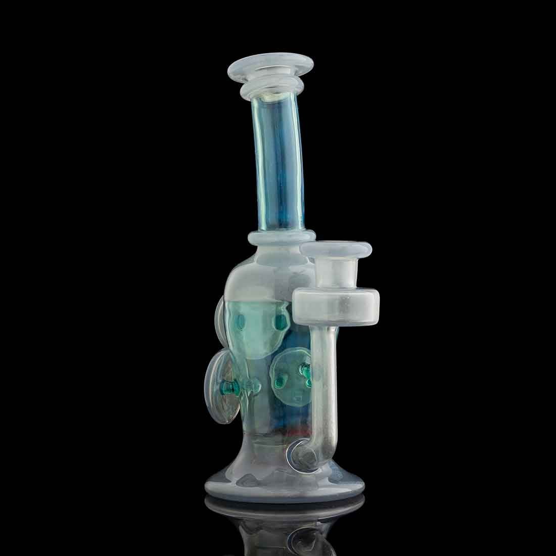 Study of Color and Process — teal and lavender recycler rig on black background